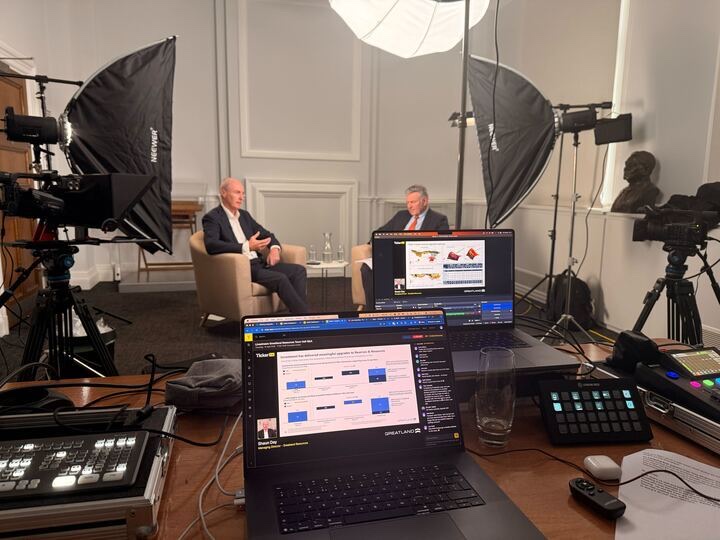 Ticker TV interview being filmed on a multi-camera studio set
